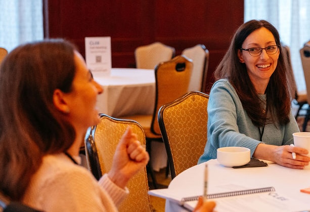 2 women working together at a table