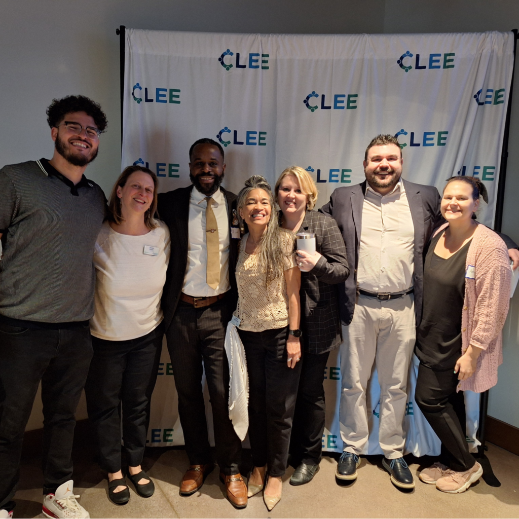 Group of PRN alum in front of a CLEE backdrop